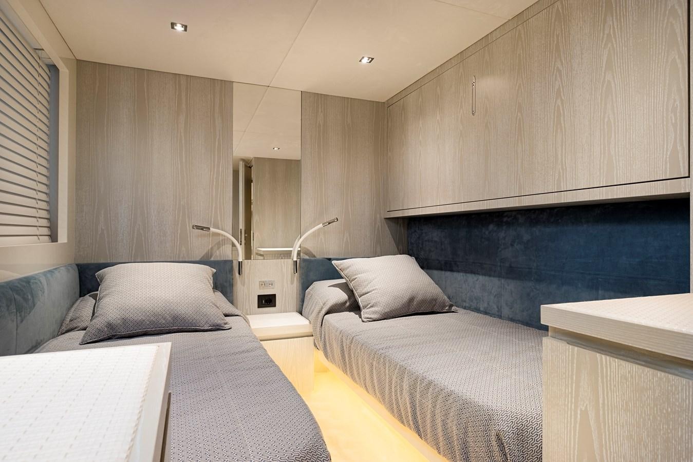 a room with a bed and a couch aboard ALIX Yacht for Sale