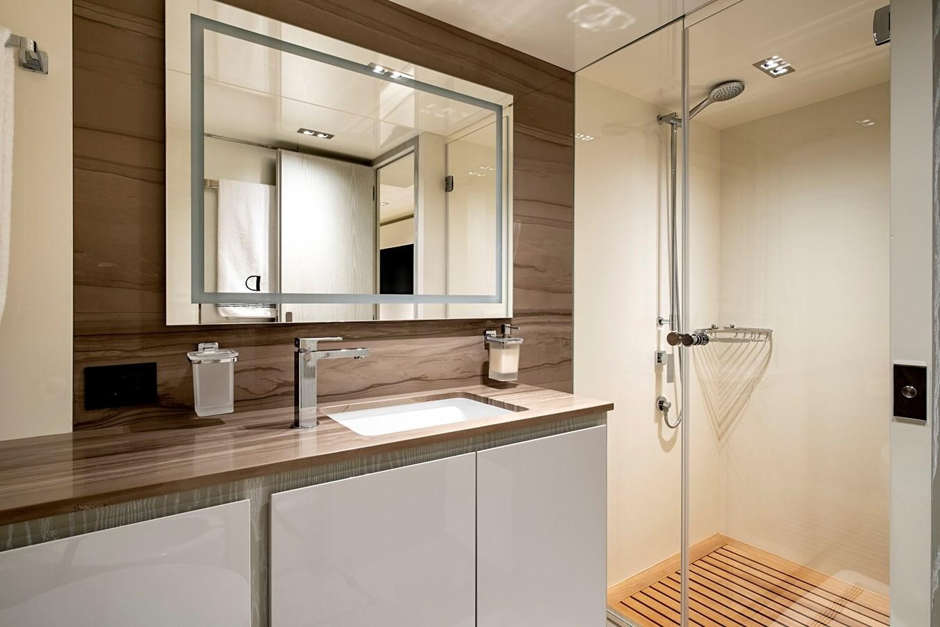 a bathroom with a large mirror aboard ALIX Yacht for Sale