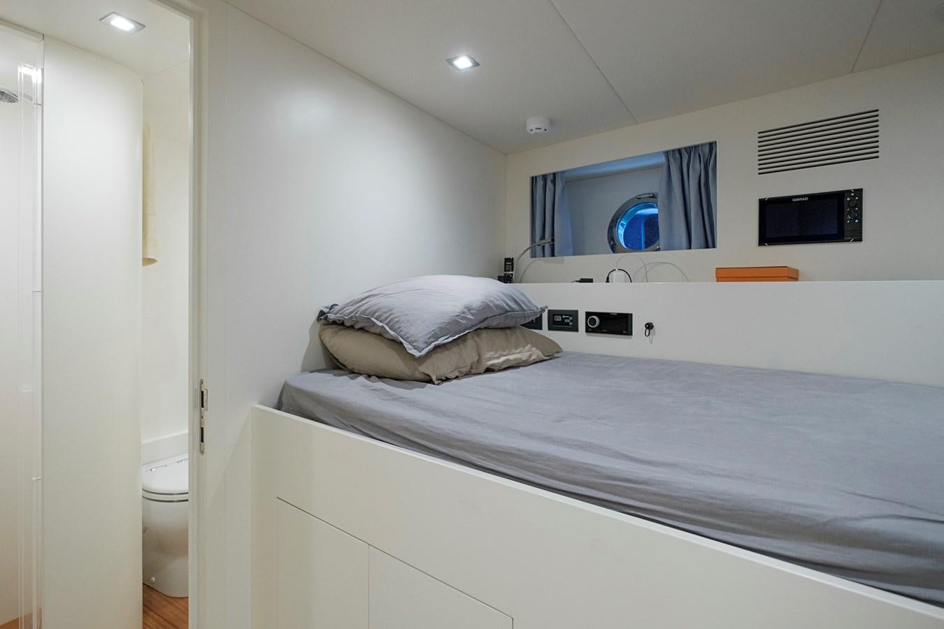 a bedroom with a bed aboard ALIX Yacht for Sale