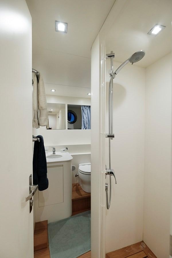 a bathroom with a shower and sink aboard ALIX Yacht for Sale
