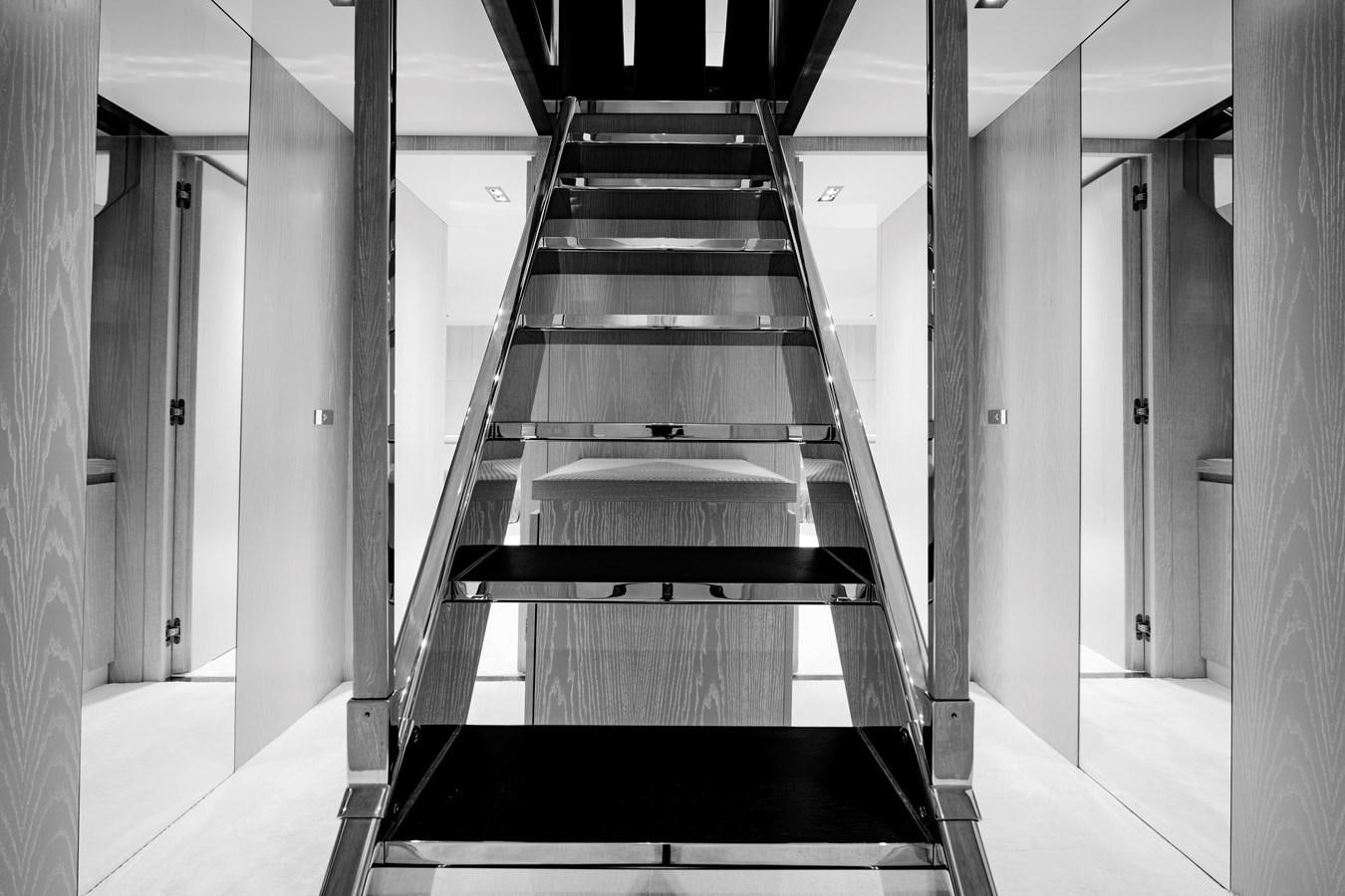 a long hallway with white walls aboard ALIX Yacht for Sale