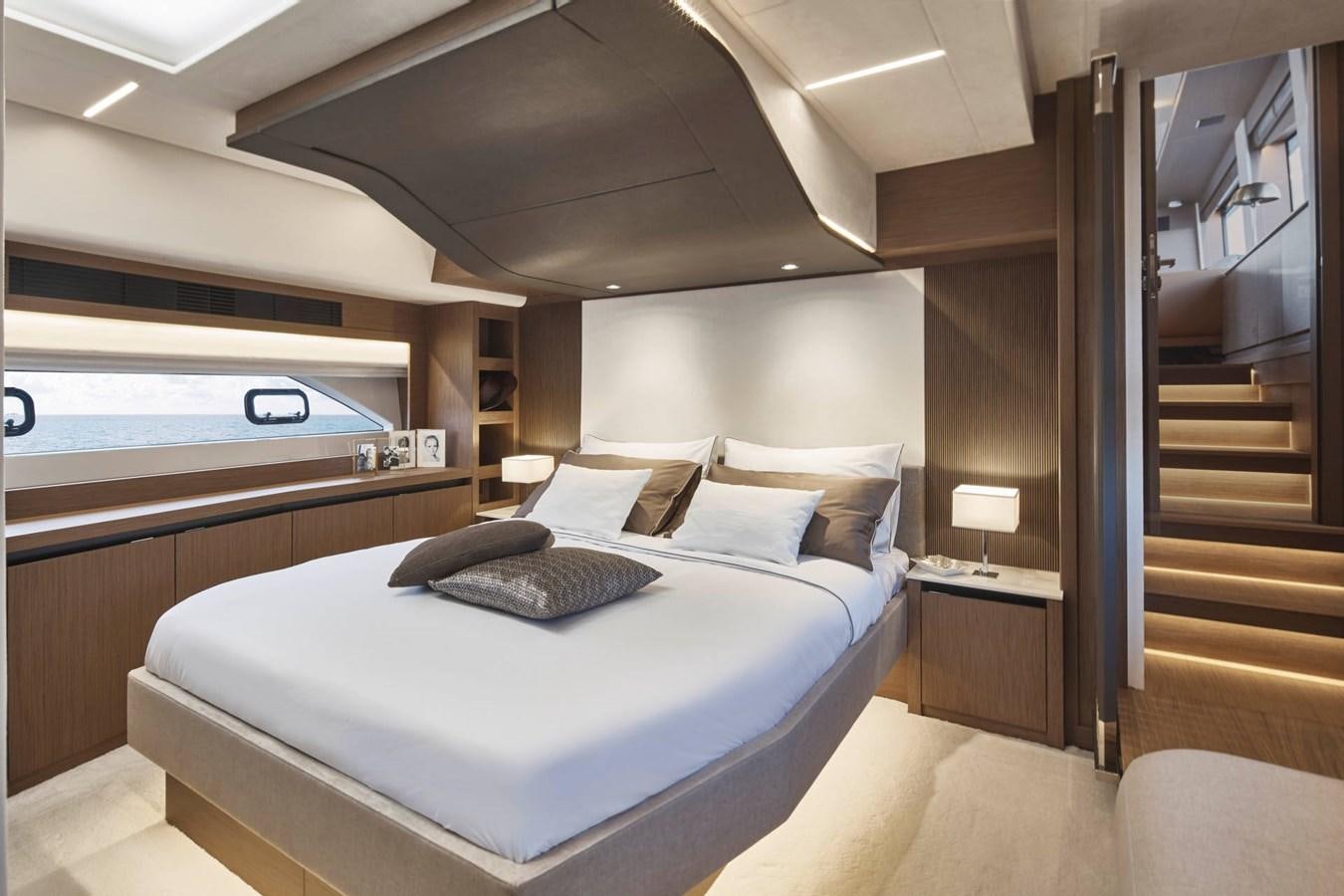 a large bed in a room aboard PRESTIGE X70 Yacht for Sale