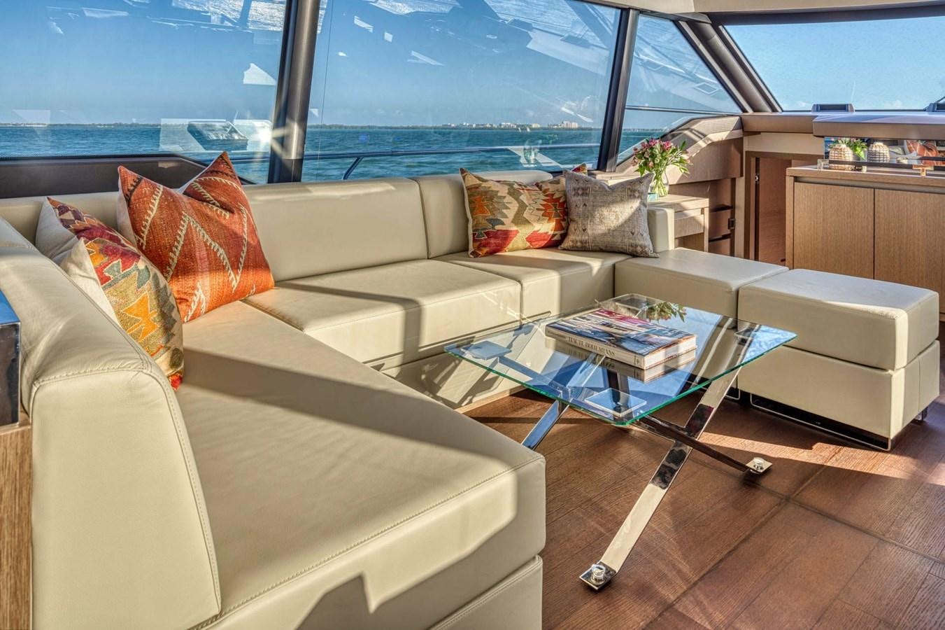 a living room with a couch and a table aboard 690 F LINE  Yacht for Sale