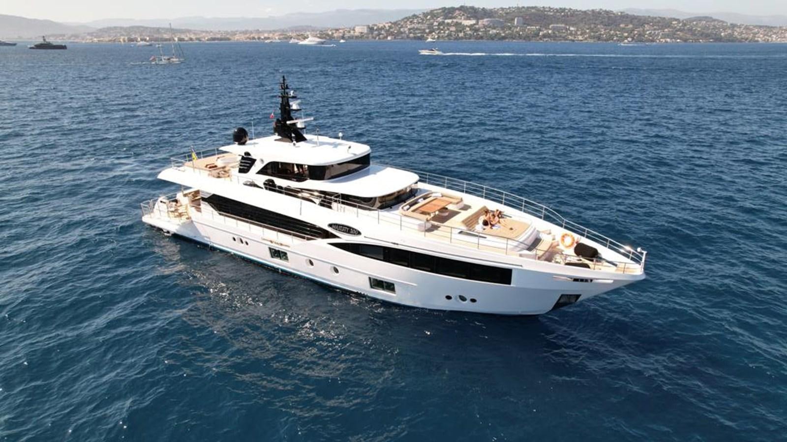 a white yacht in the water aboard CAROBELLE Yacht for Sale