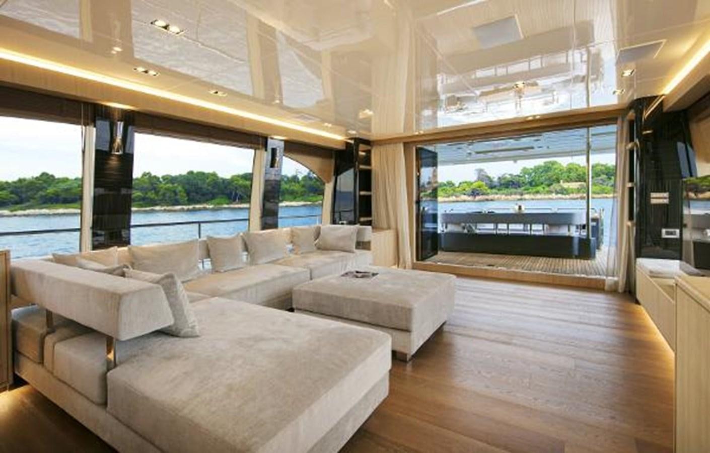 a room with a couch and a window aboard URSUS Yacht for Sale