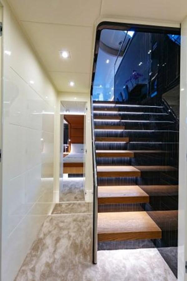 a hallway with a set of stairs aboard URSUS Yacht for Sale