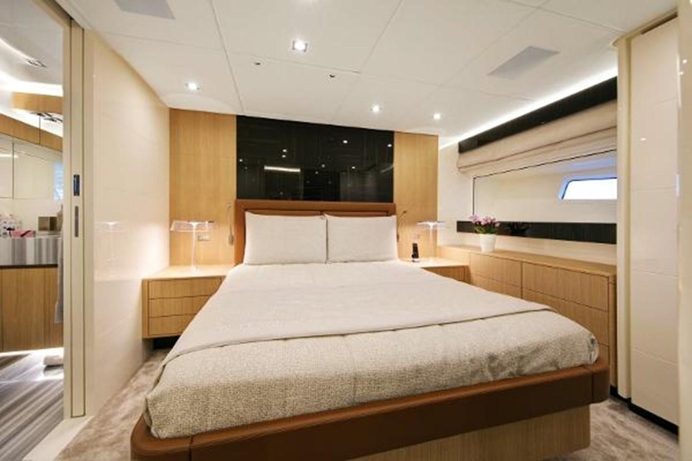 a large bed in a room aboard URSUS Yacht for Sale
