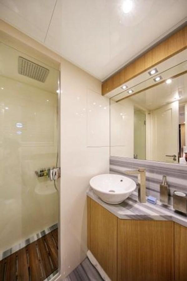 a bathroom with a sink and a mirror aboard URSUS Yacht for Sale