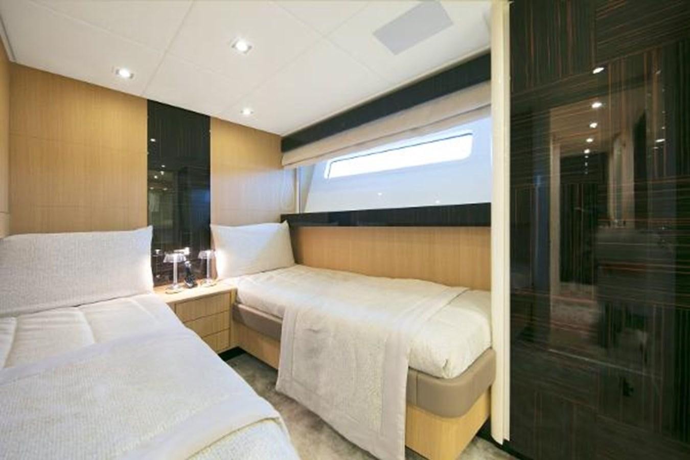 a room with two beds aboard URSUS Yacht for Sale