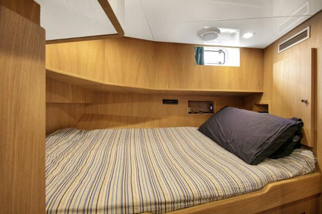 a bed in a room aboard URSUS Yacht for Sale