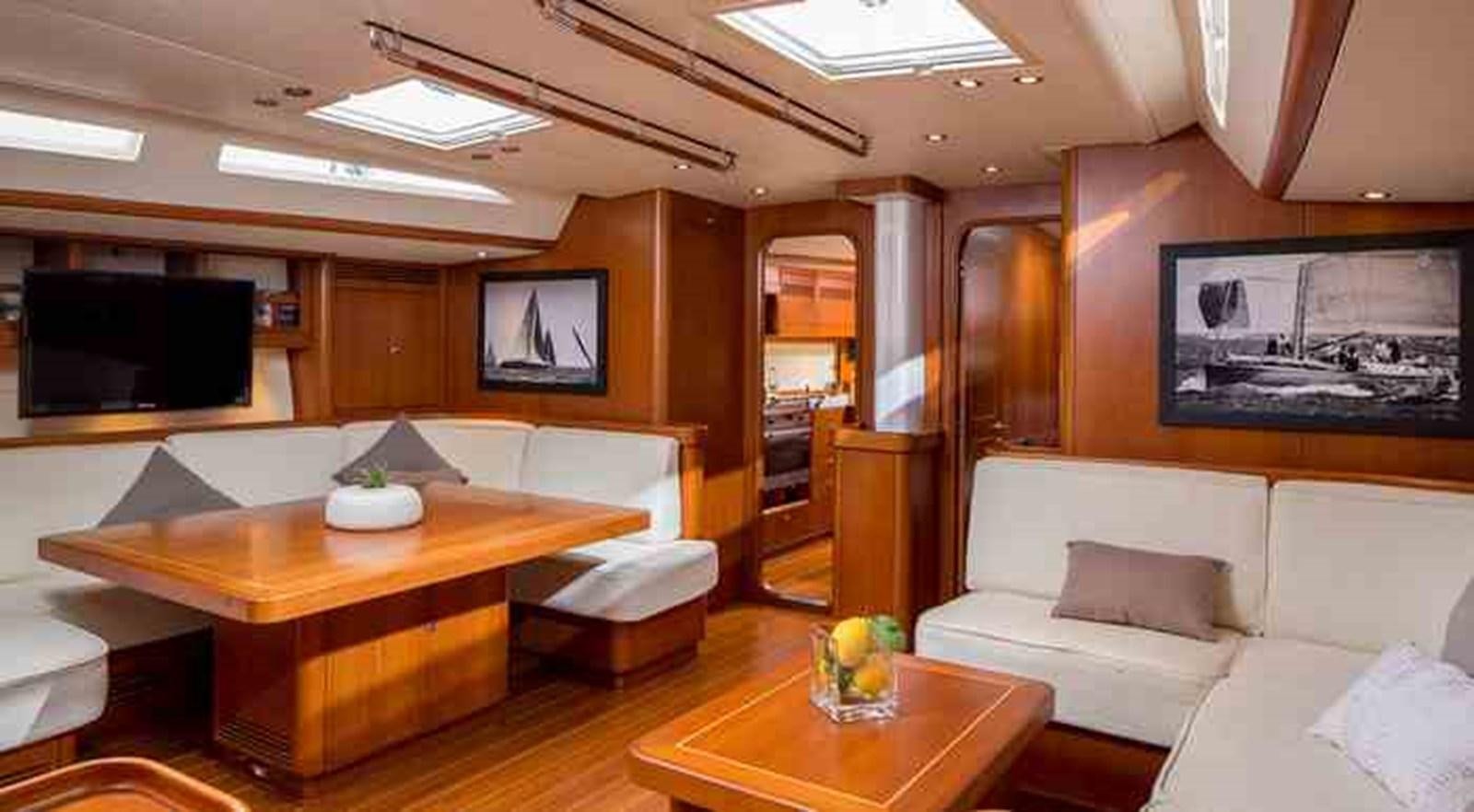 a living room with a couch and a tv aboard ELISE WHISPER Yacht for Sale