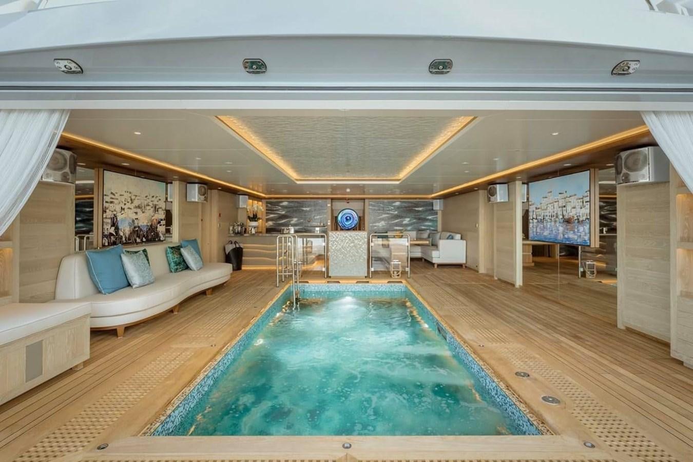 a large indoor swimming pool aboard VICTORIOUS Yacht for Sale