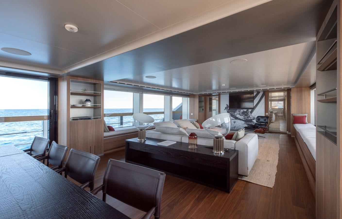 a living room with a large window aboard MYKO Yacht for Sale