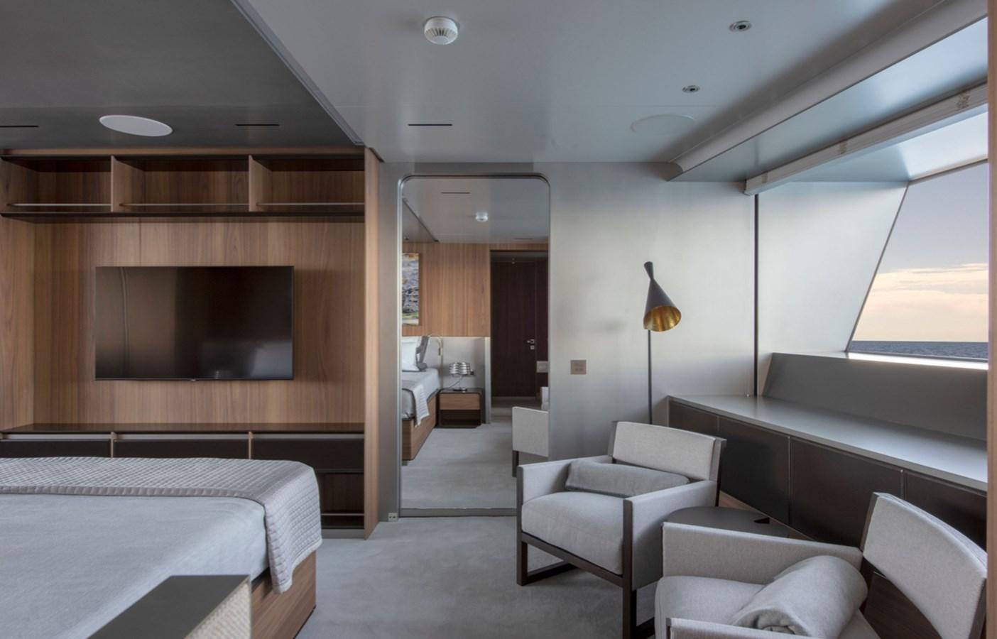 a room with a bed and a couch aboard MYKO Yacht for Sale