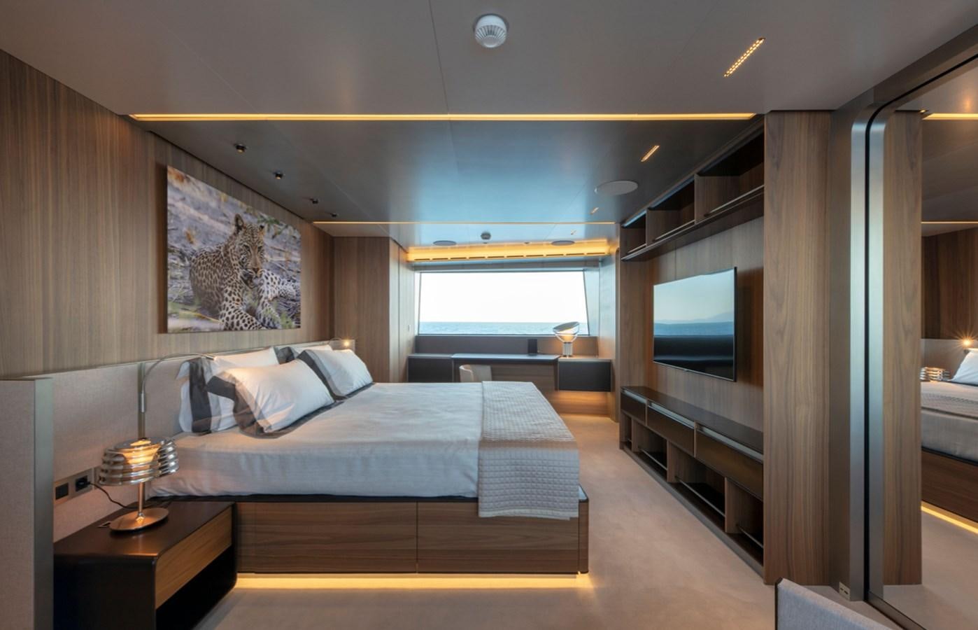 a bedroom with a large bed aboard MYKO Yacht for Sale