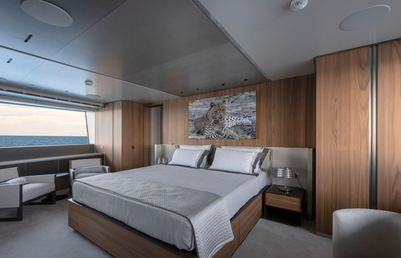 a large bedroom with a large bed aboard MYKO Yacht for Sale
