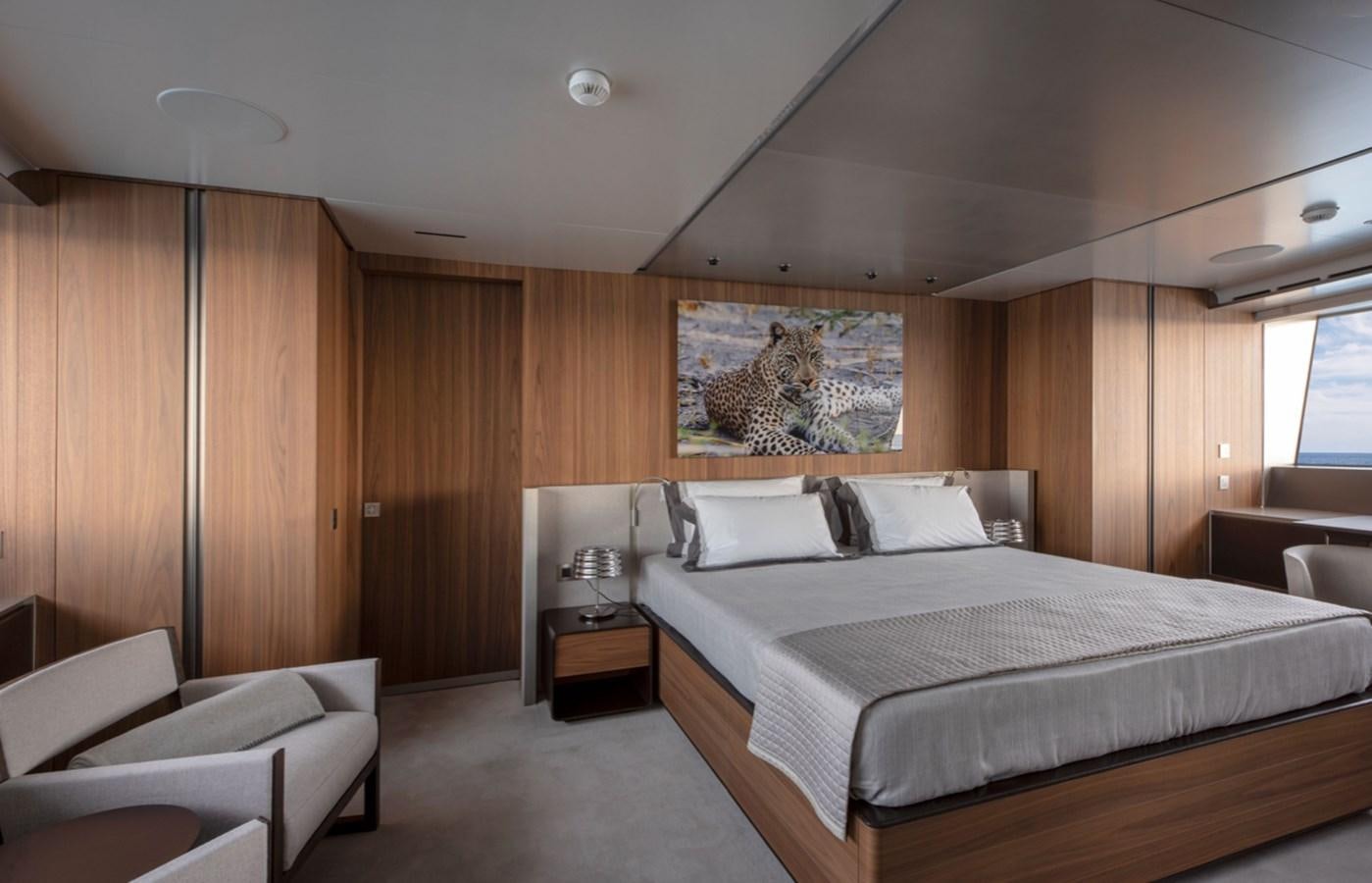 a large bedroom with a bed aboard MYKO Yacht for Sale
