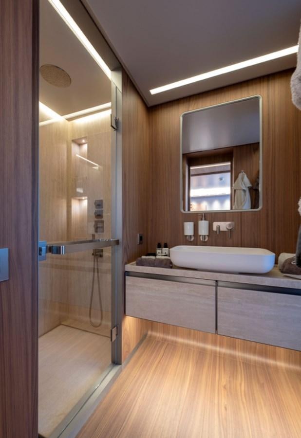 a bathroom with a large mirror aboard MYKO Yacht for Sale