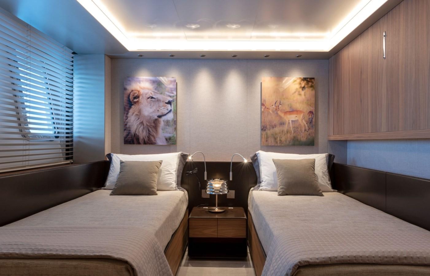 a room with two beds aboard MYKO Yacht for Sale