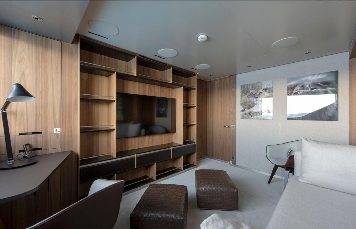 a living room with a large shelf aboard MYKO Yacht for Sale