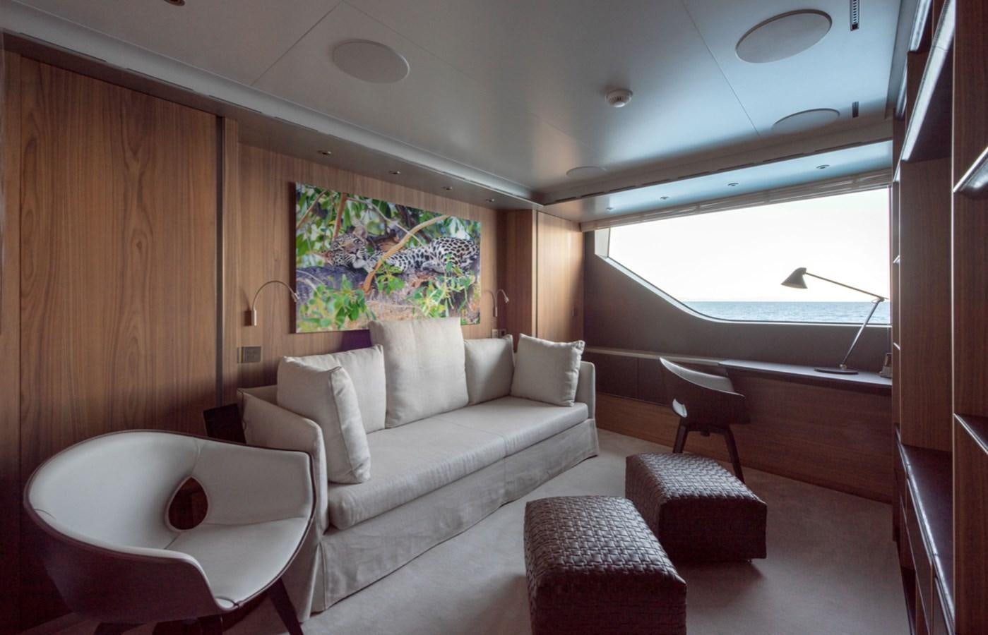 a room with a couch and a table aboard MYKO Yacht for Sale