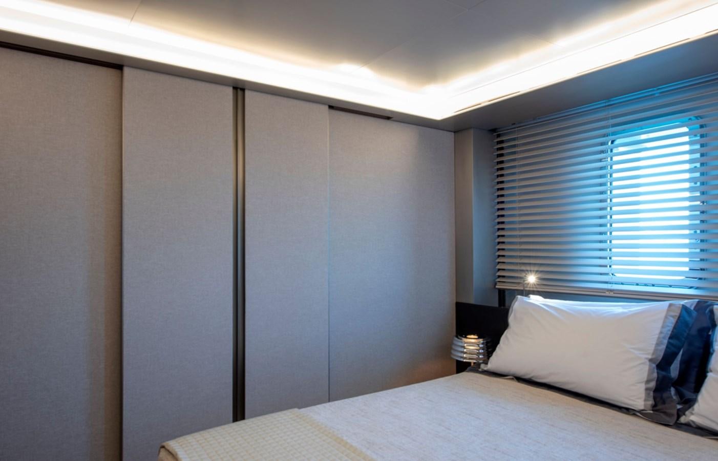 a bed with a white pillow aboard MYKO Yacht for Sale