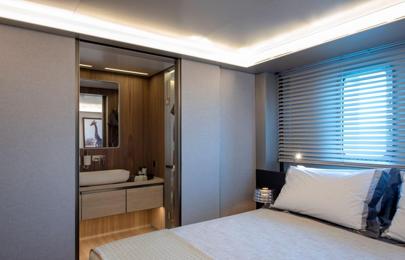 a bedroom with a large bed aboard MYKO Yacht for Sale