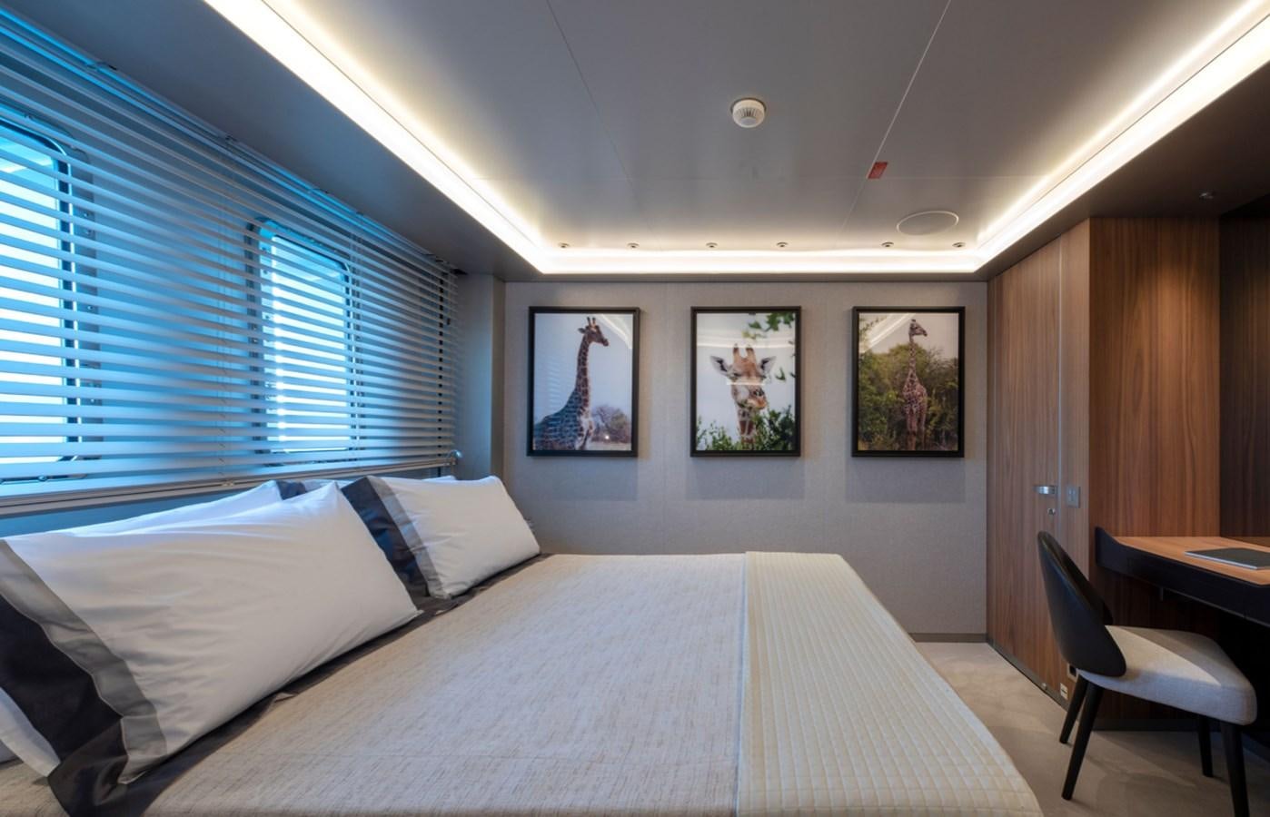 a room with two beds aboard MYKO Yacht for Sale