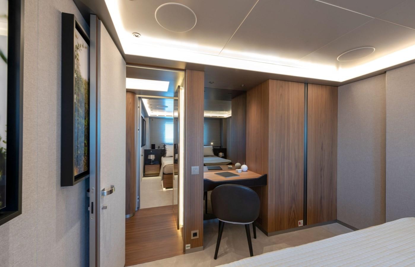 a room with a desk and a chair aboard MYKO Yacht for Sale