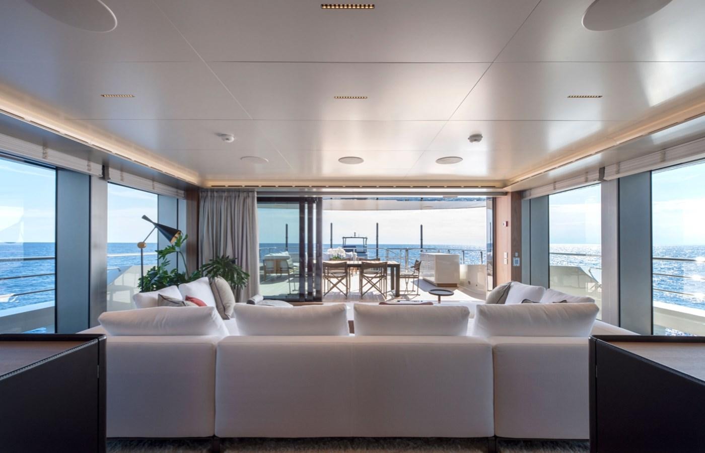 a room with a large bed and a large window aboard MYKO Yacht for Sale