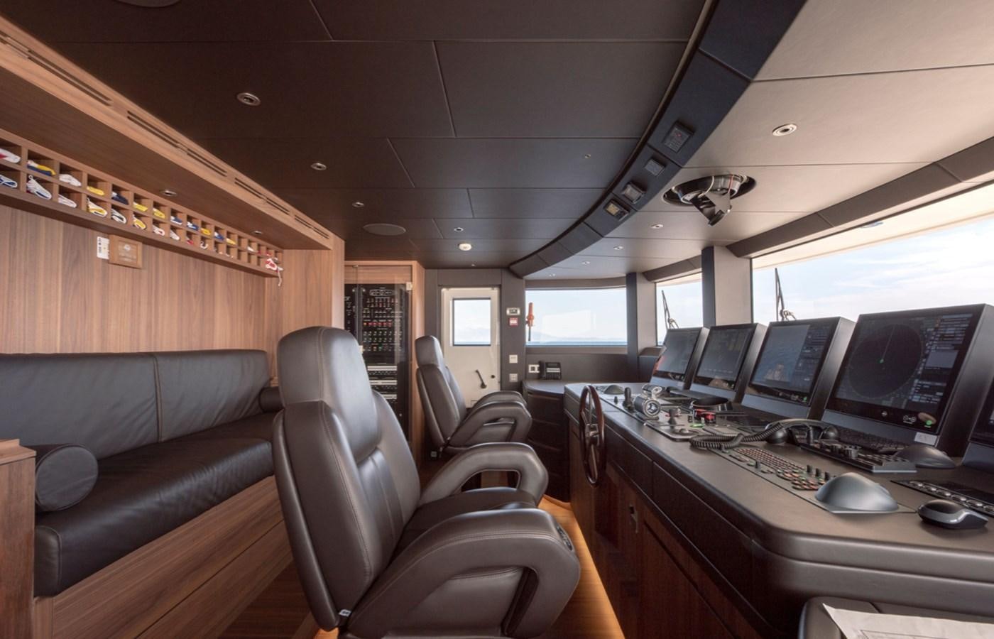 a room with a desk and computers aboard MYKO Yacht for Sale