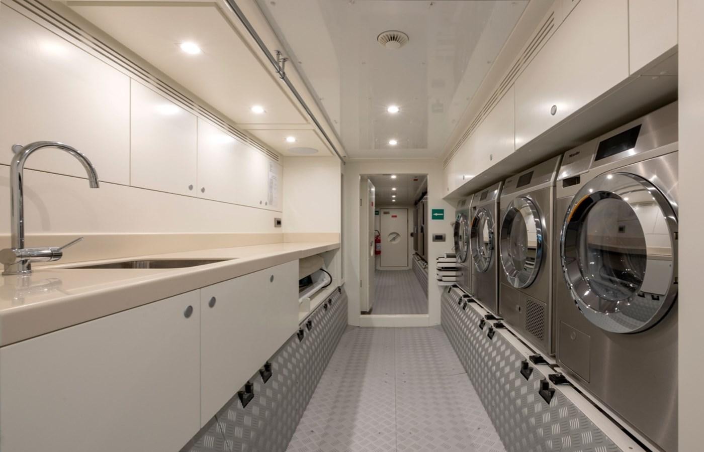 a bathroom with a large mirror aboard MYKO Yacht for Sale