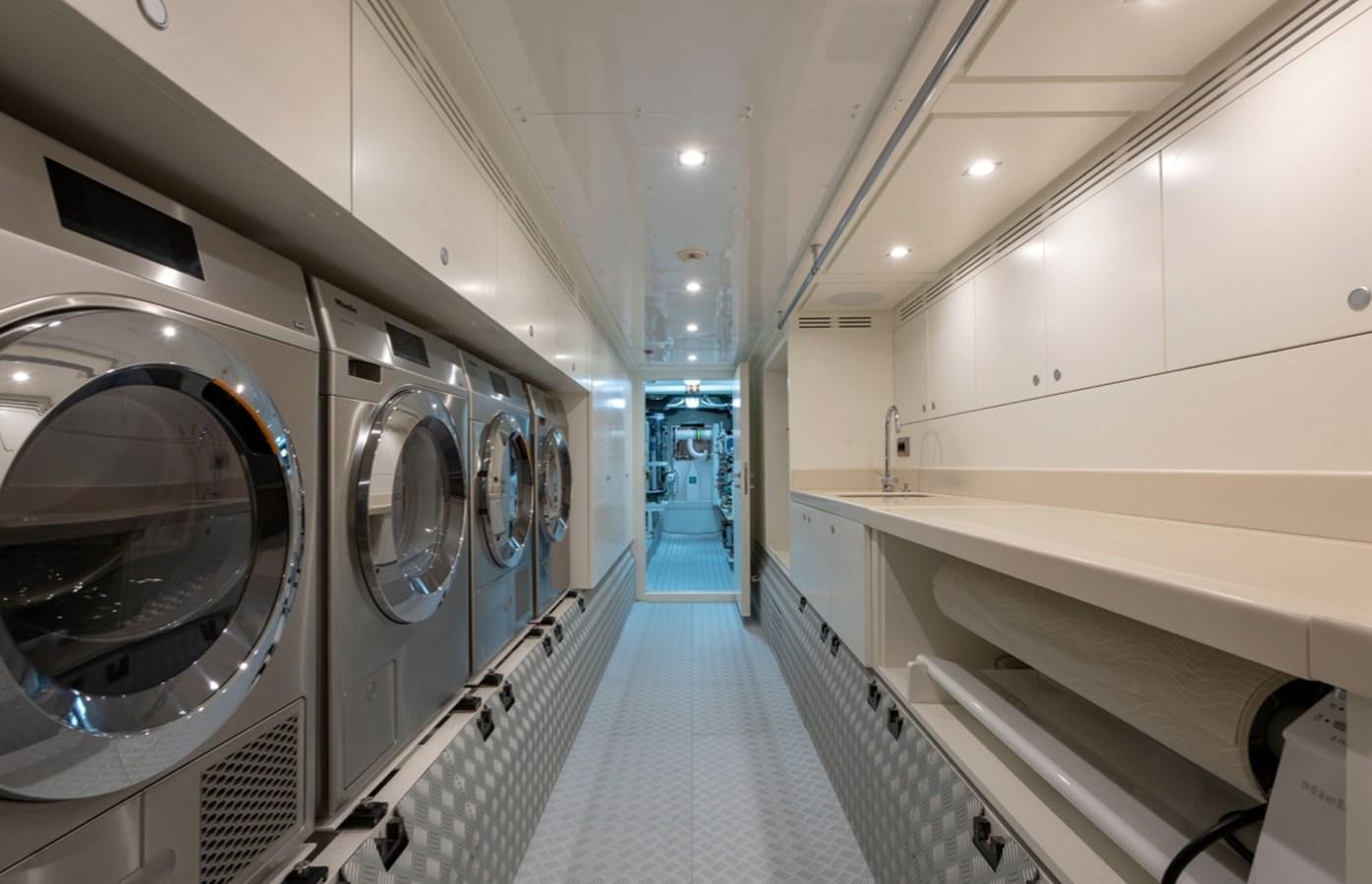 a long hallway with a large mirror aboard MYKO Yacht for Sale