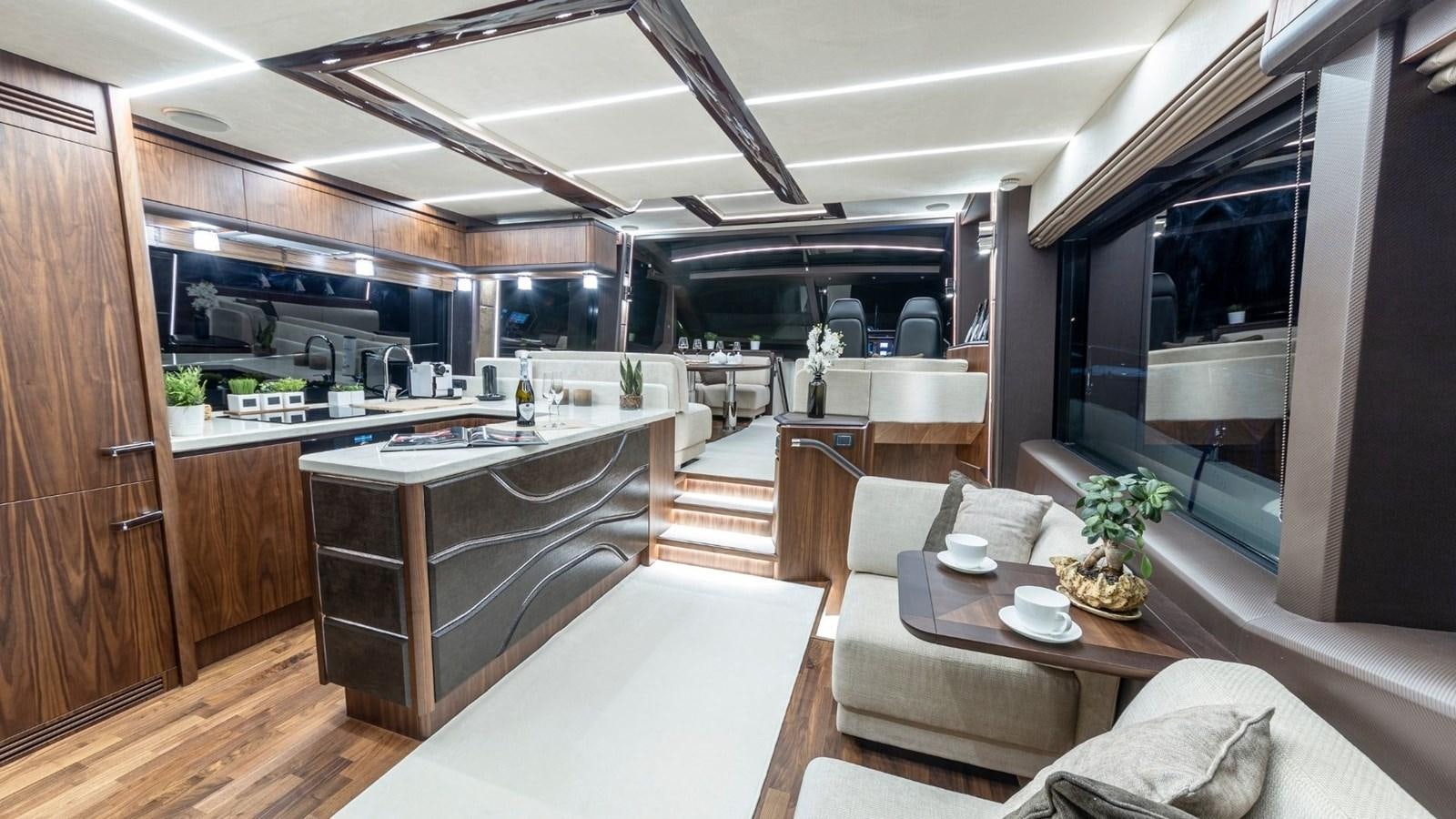 a modern kitchen with a large island aboard GALEON 680 FLY Yacht for Sale