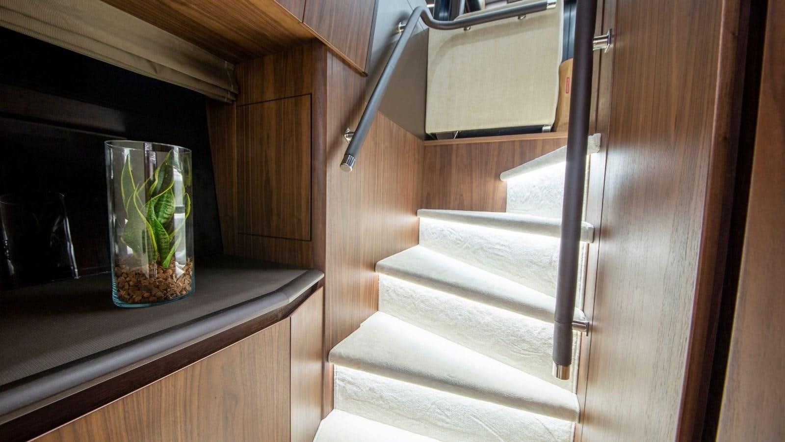 a wooden staircase in a house aboard GALEON 680 FLY Yacht for Sale