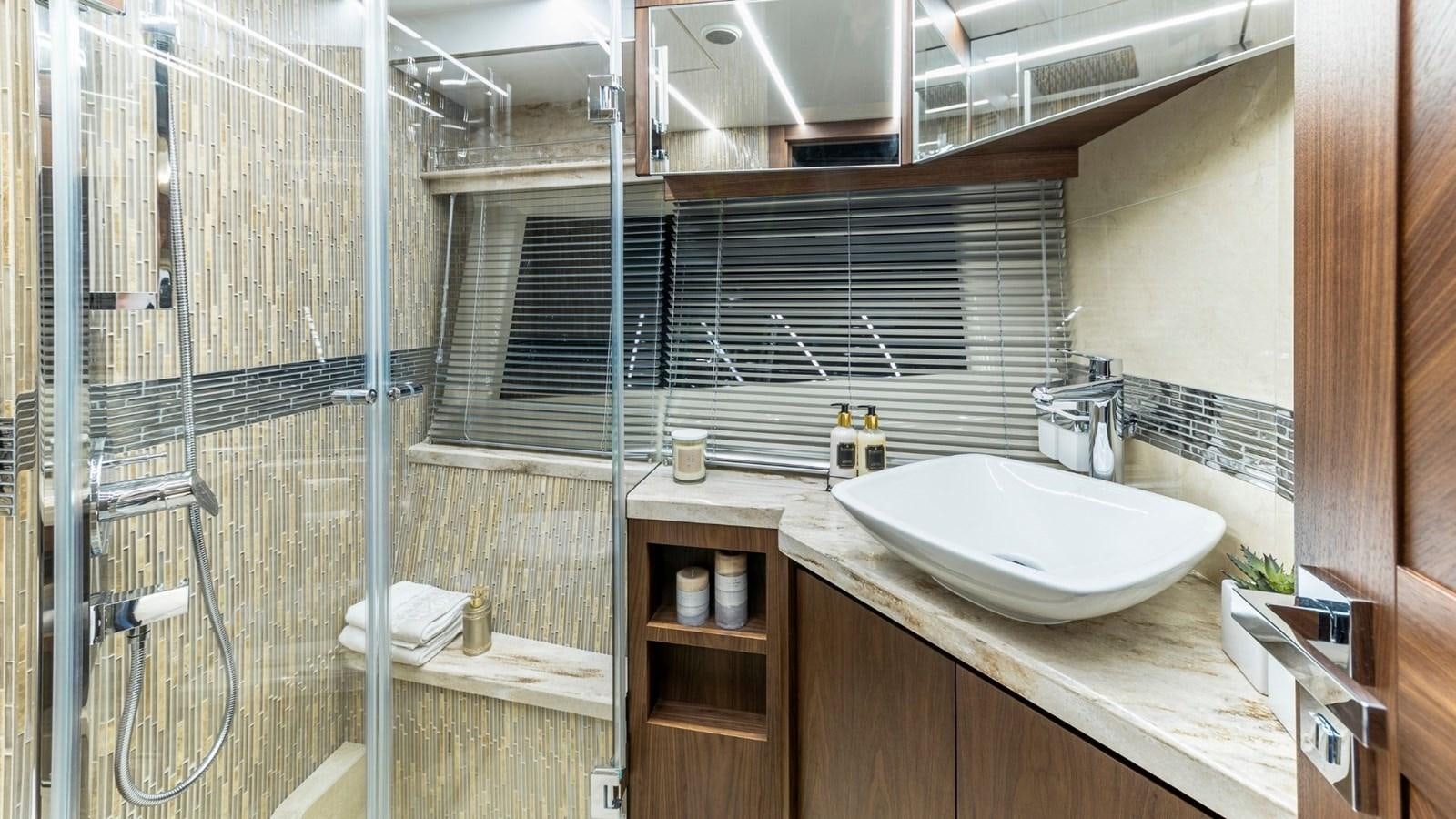 a bathroom with a sink and a mirror aboard GALEON 680 FLY Yacht for Sale