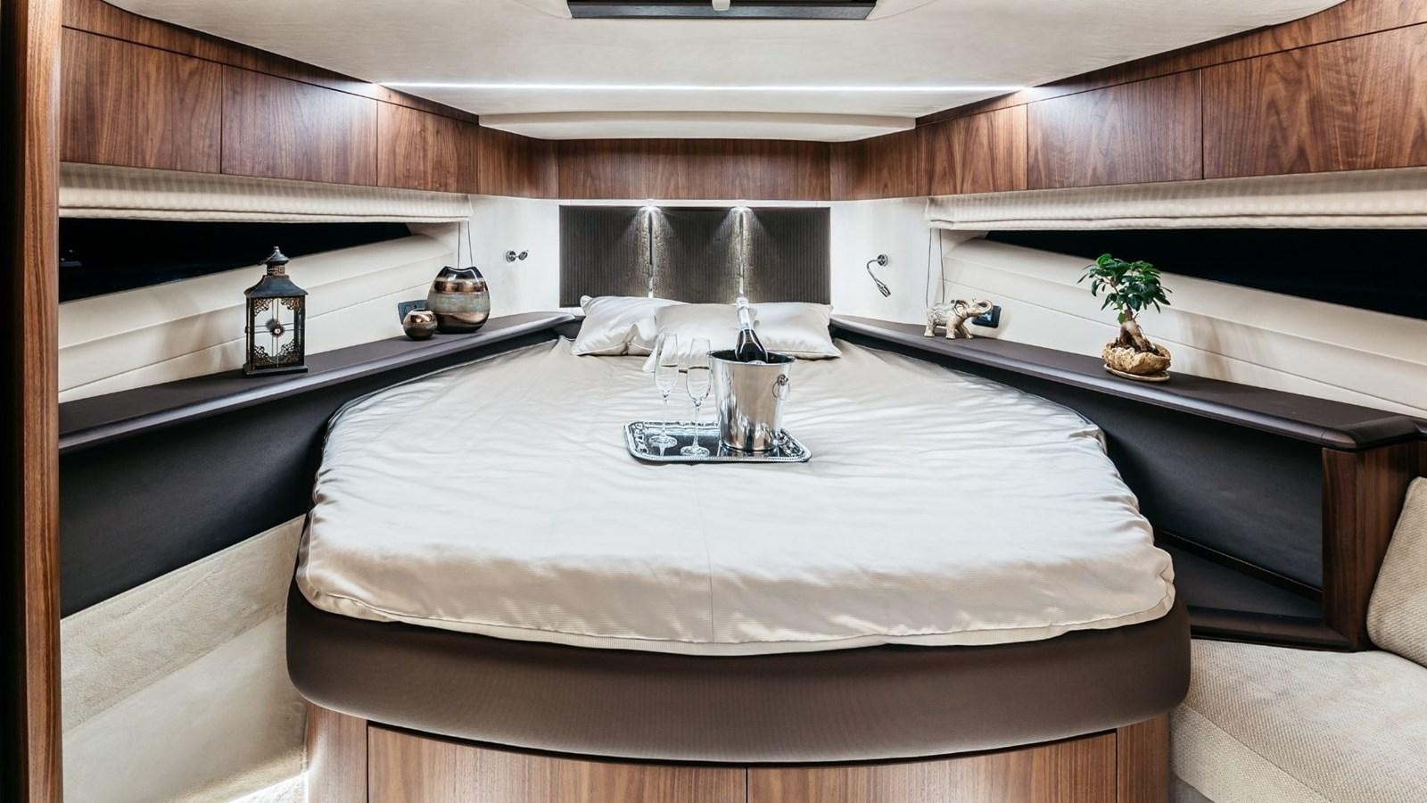 a large bed with a white sheet aboard GALEON 680 FLY Yacht for Sale