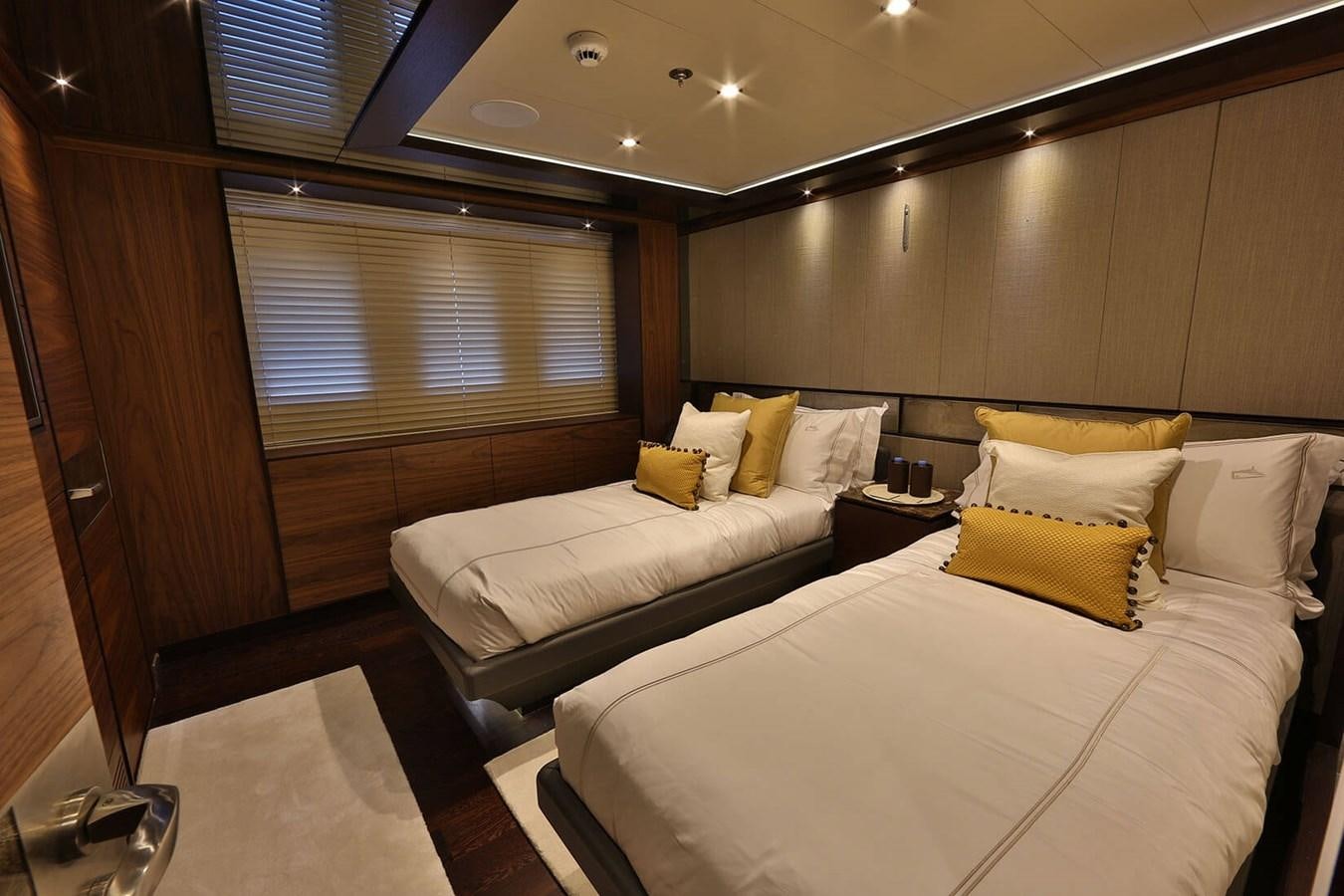 a room with two beds aboard QUASAR Yacht for Charter