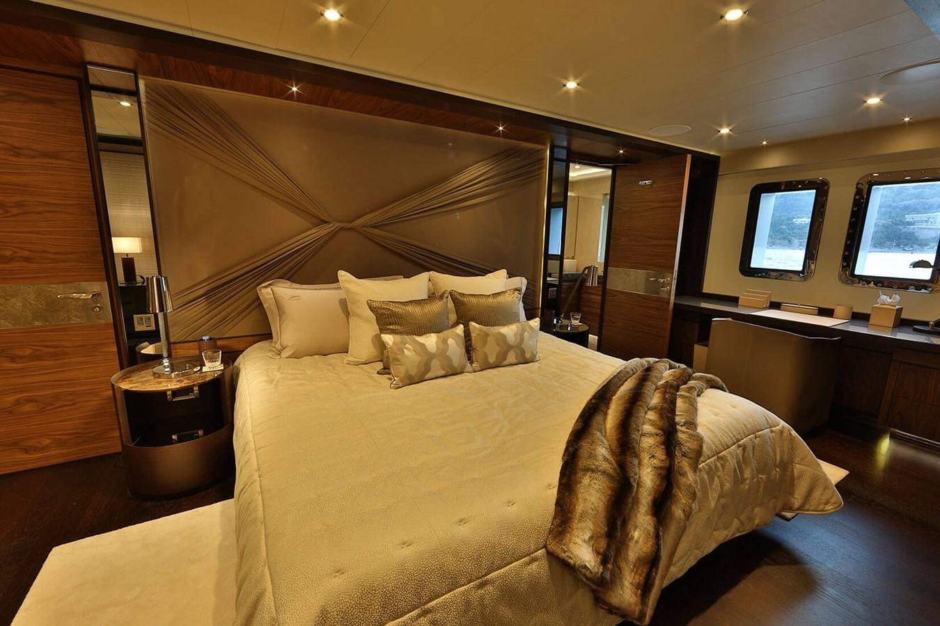 a bed with a large bed aboard QUASAR Yacht for Charter
