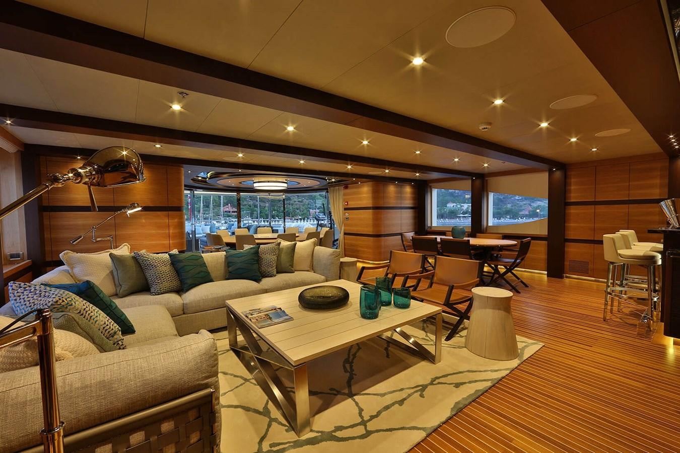 a living room with a large window aboard QUASAR Yacht for Charter