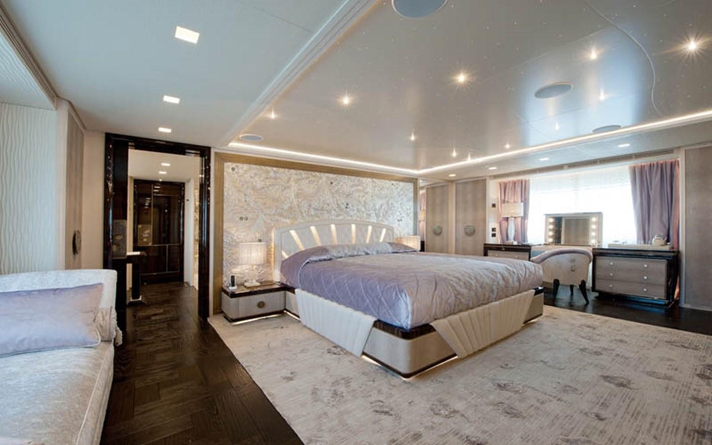 a large bedroom with a large bed aboard SCORPION Yacht for Sale