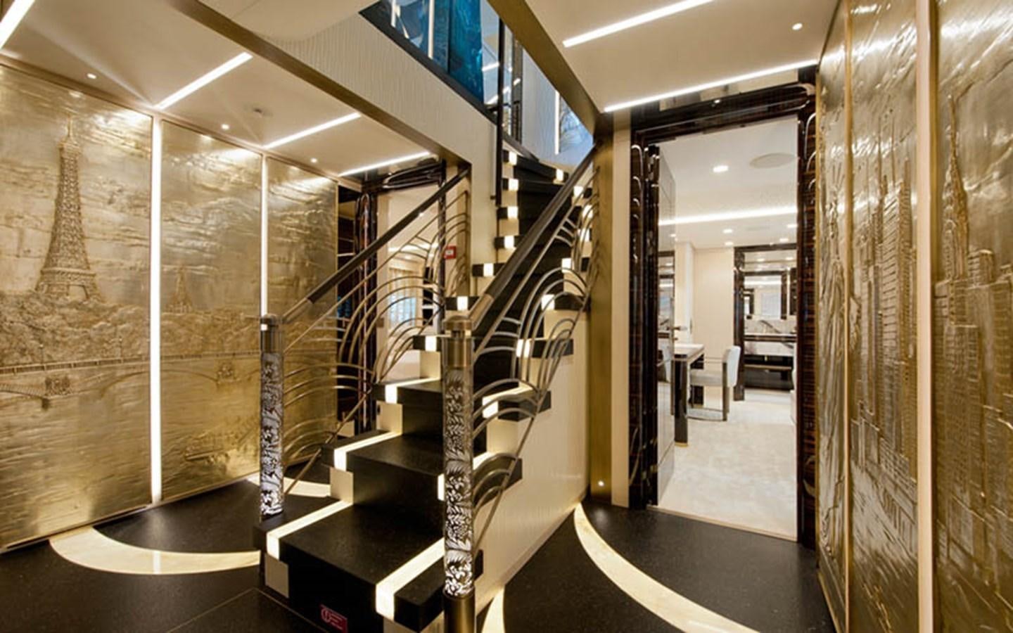 a room with a staircase and a glass wall aboard SCORPION Yacht for Sale