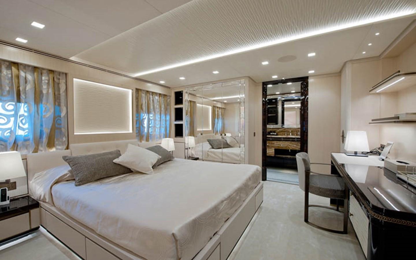a large bedroom with a large bed aboard SCORPION Yacht for Sale