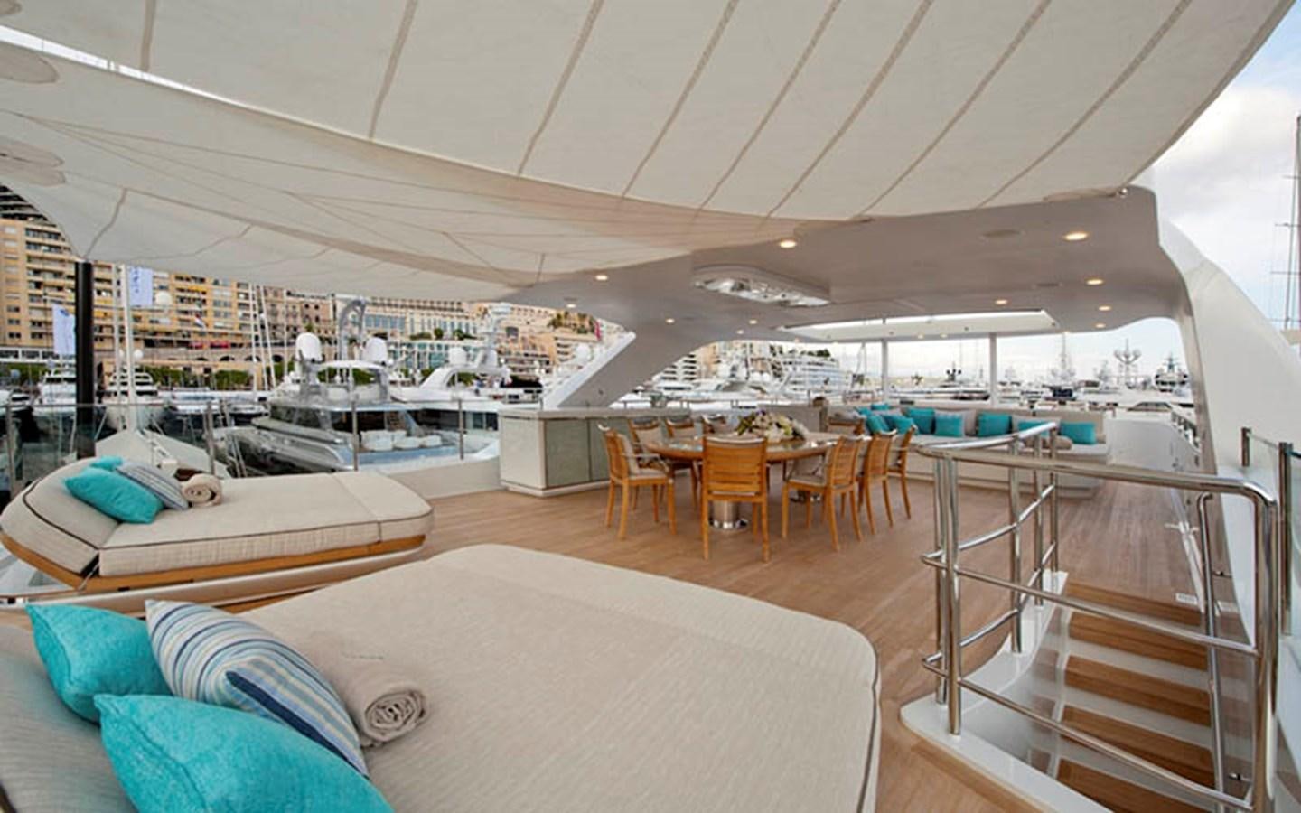 a large room with a bed and a couch aboard SCORPION Yacht for Sale