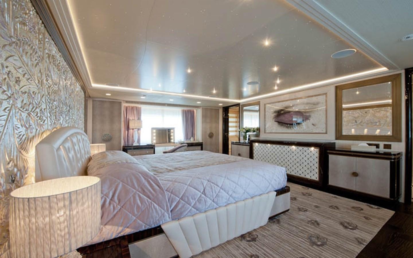 a large bedroom with a large bed aboard SCORPION Yacht for Sale