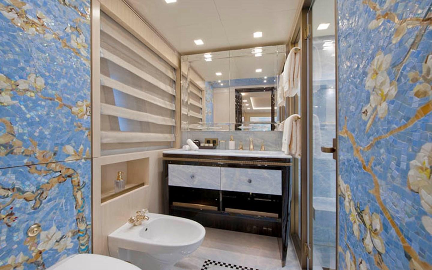 a bathroom with a sink and a mirror aboard SCORPION Yacht for Sale