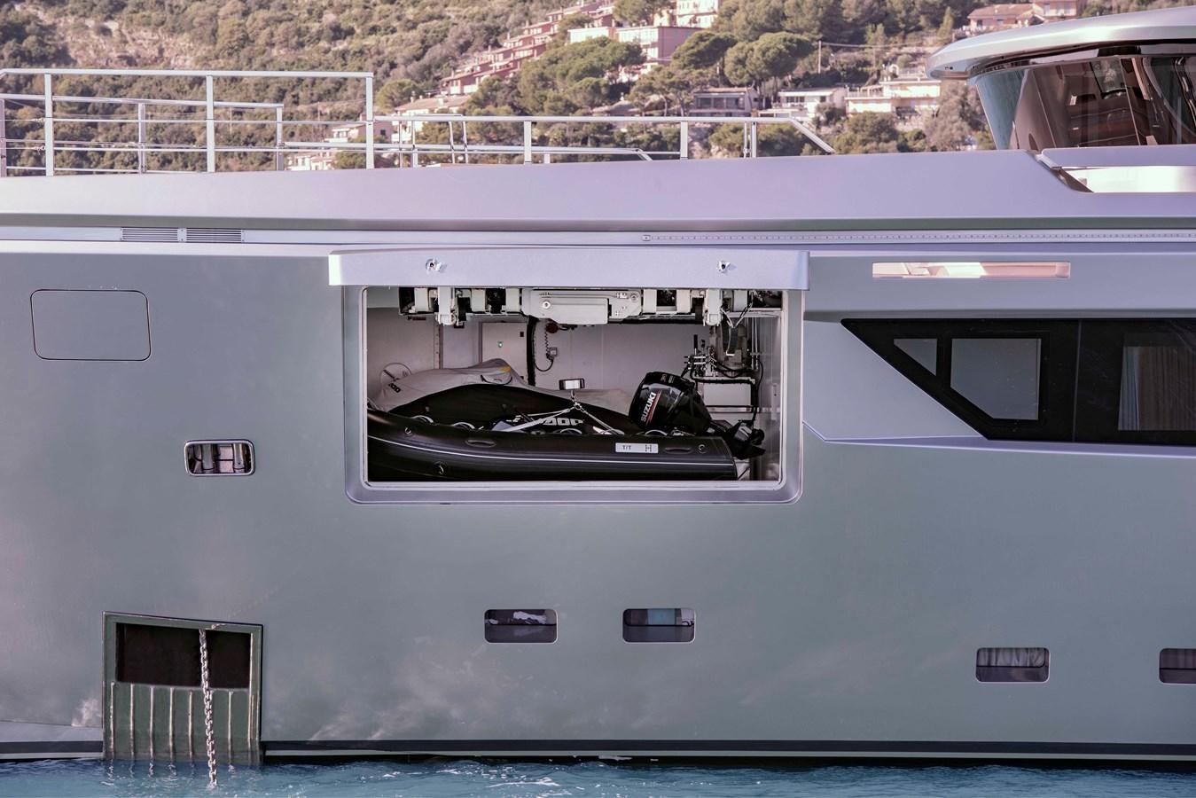 a white vehicle with a door open aboard PAIZA ONE Yacht for Sale