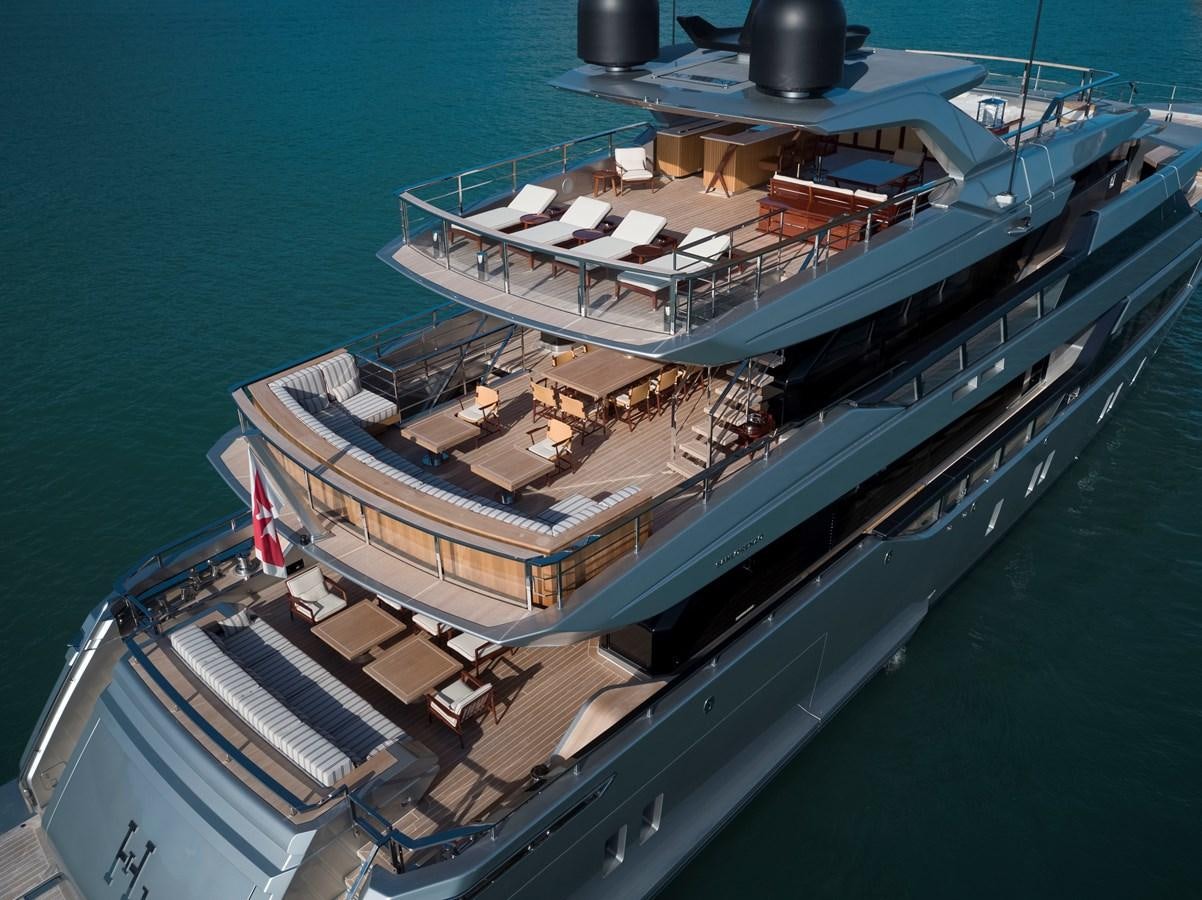 a large ship in the water aboard PAIZA ONE Yacht for Sale