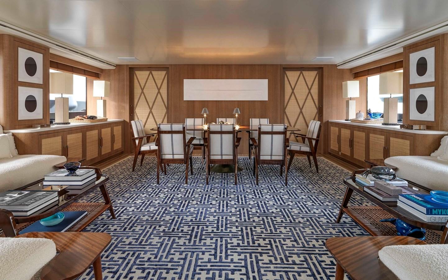 a room with chairs and tables aboard PAIZA ONE Yacht for Sale