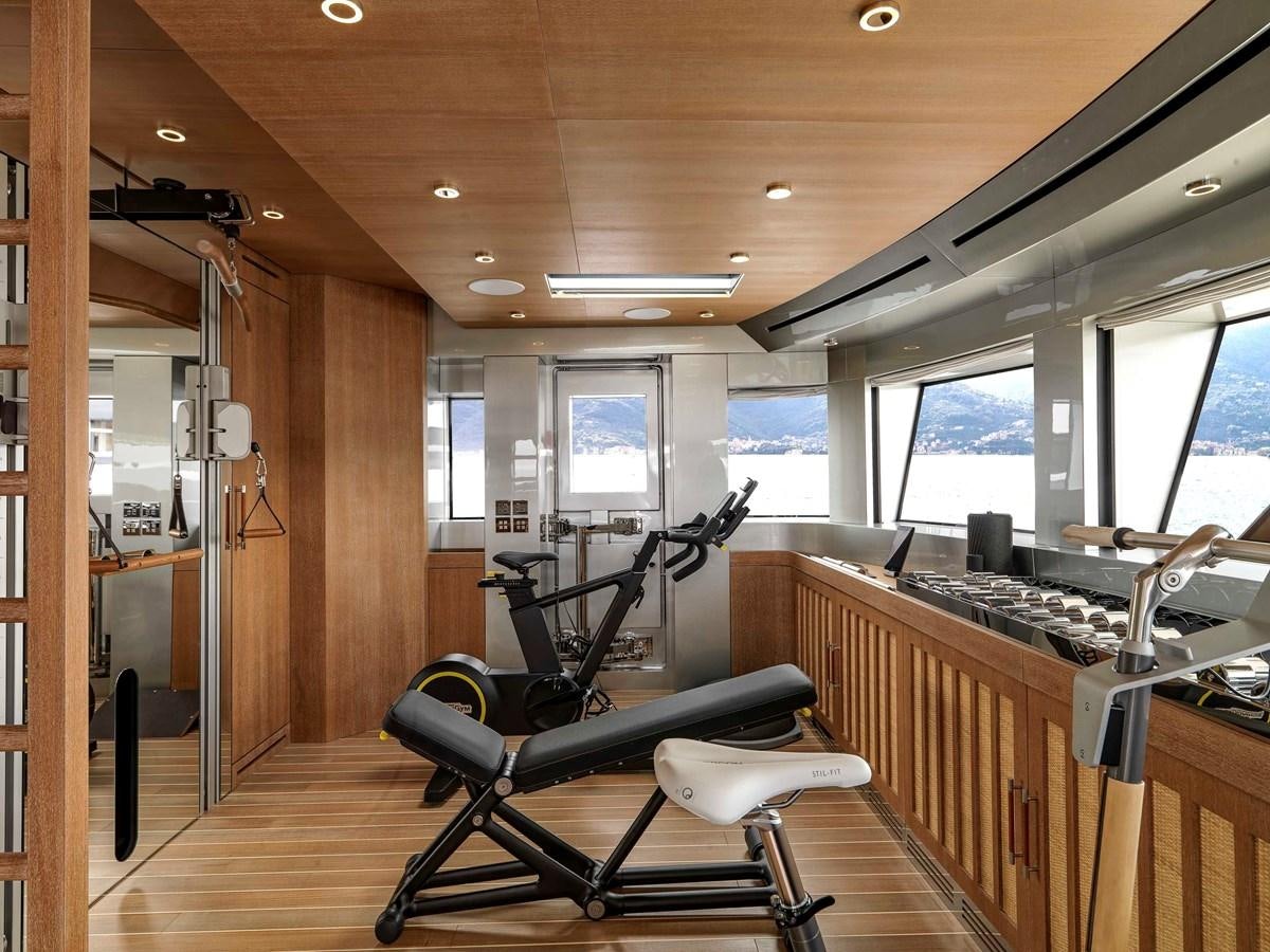 a gym with treadmills aboard PAIZA ONE Yacht for Sale